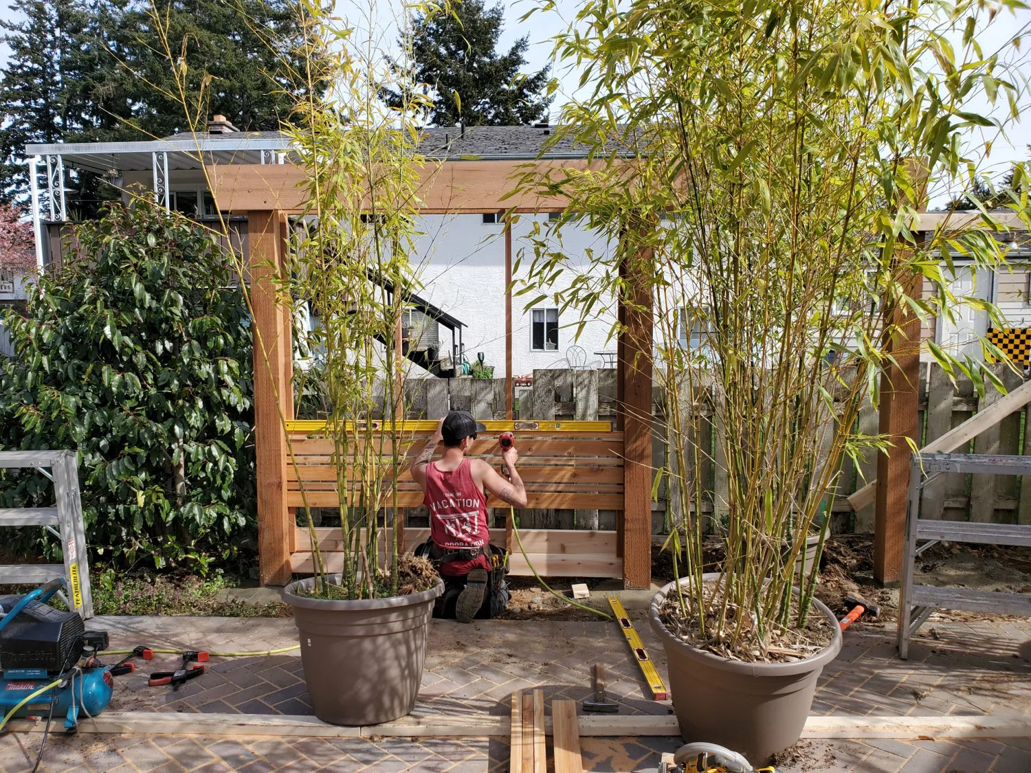 employee working on fencing screen